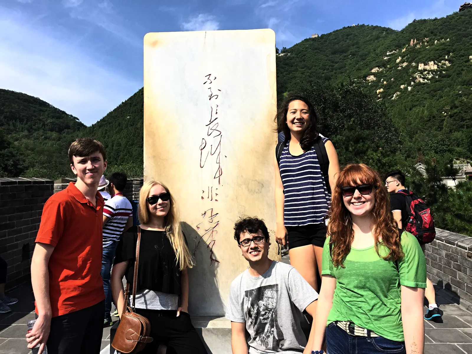 Students beside an inscribed stele on the Great Wall